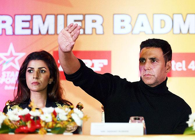 Bollywood actor Akshay Kumar and Nirmit Kaur watch the Premier Badminton League match in Lucknow on Monday