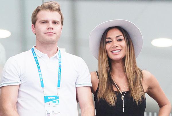 Singer Nicole Sherzinger (right) was all smiles after Bulgarian Grigor Dimitrov's win over Frenchman Gilles Simon