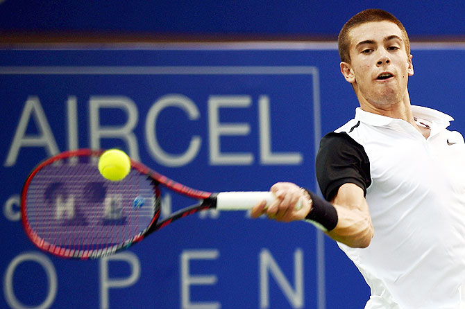Borna Coric of Croatia in action against Austin Krajicek of USA during their second round match for the ATP Chennai Open 2016 at SDAT Tennis Stadium in Chennai on Wednesday