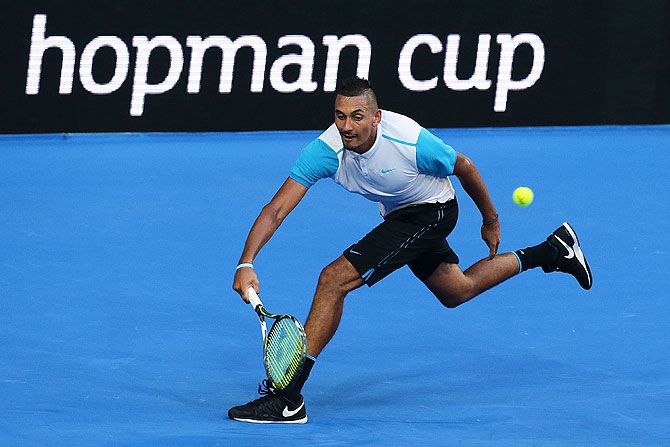  Australia's Nick Krygios plays a forehand against Britain's Andy Murray during their men's singles match at the 2016 Hopman Cup at Perth Arena on Wednesday