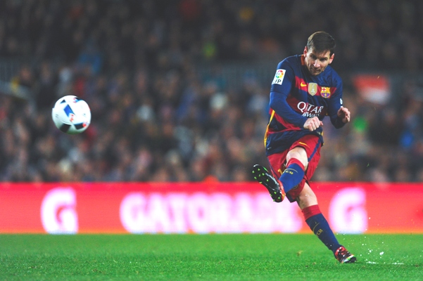 Lionel Messi of FC Barcelona takes a free kick 