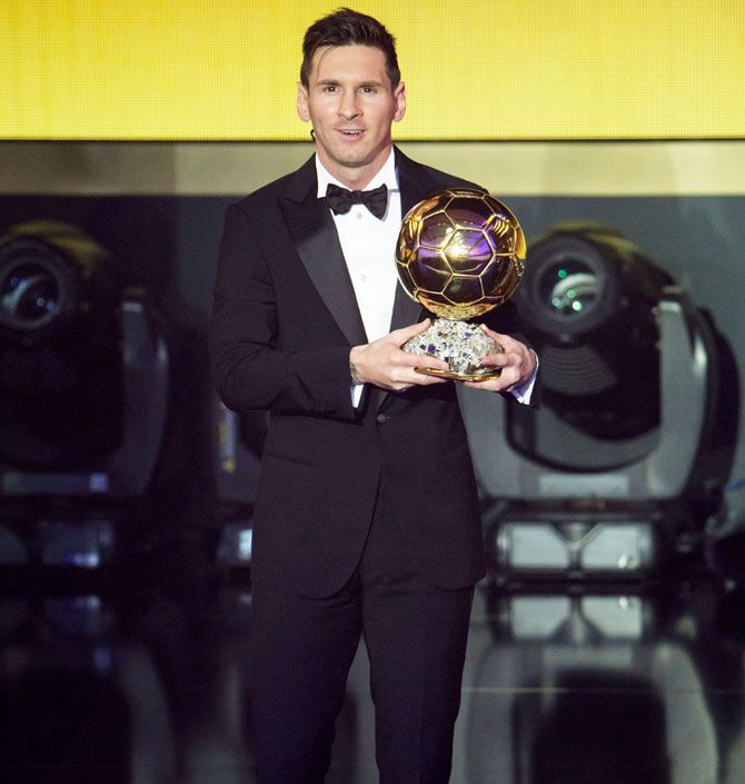 FIFA Ballon d'Or winner Lionel Messi poses with his trophy
