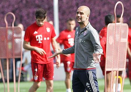 Bayern Munich's coach Pep Guardiola gestures during a training session at his team winter training camp in Doha