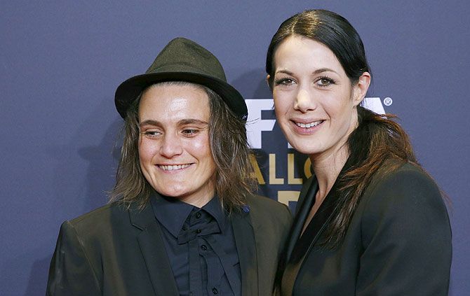 Germany's Nadine Angerer and her partner Magda (right) arrive for the FIFA Ballon d'Or Gala