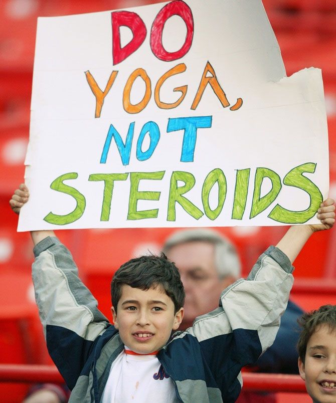 A young fan encourages players to substitute yoga for steroids