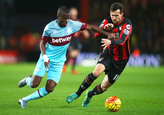 West Ham United's Enner Valencia and Bournemouth's Charlie Daniels tussle for the ball during the Barclays English Premier League match at Vitality Stadium in Bournemouth