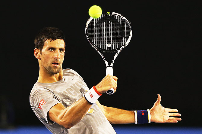  Serbia's Novak Djokovic hits a backhand volley during a practice session 