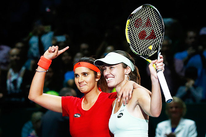 Sania Mirza of India and Martina Hingis of Switzerland celebrate