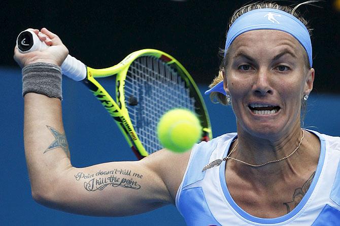 Russia's Svetlana Kuznetsova plays a shot during her women's singles semi-final against Romania's Simona Halep on Friday