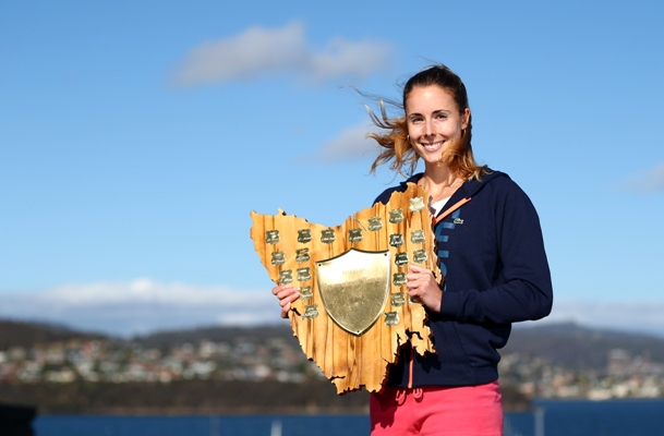 Alize Cornet of France poses with the winners trophy in Hobart 
