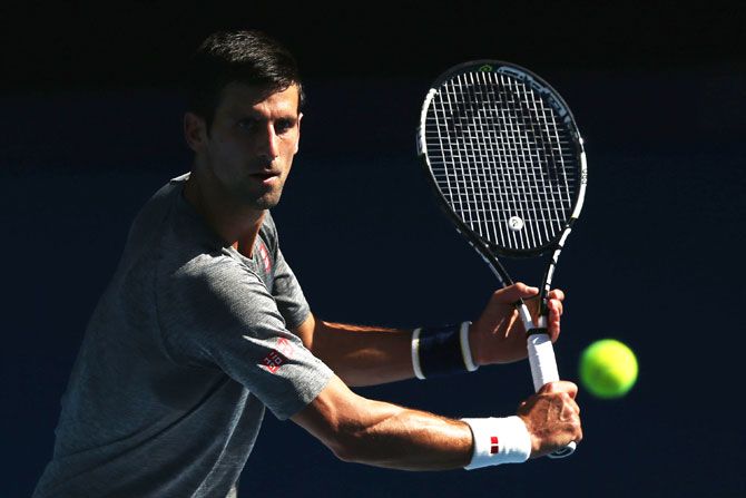 Novak Djokovic of Serbia hits a backhand volley during a practice session ahead of the 2016 Australian Open at Melbourne Park on Sunday
