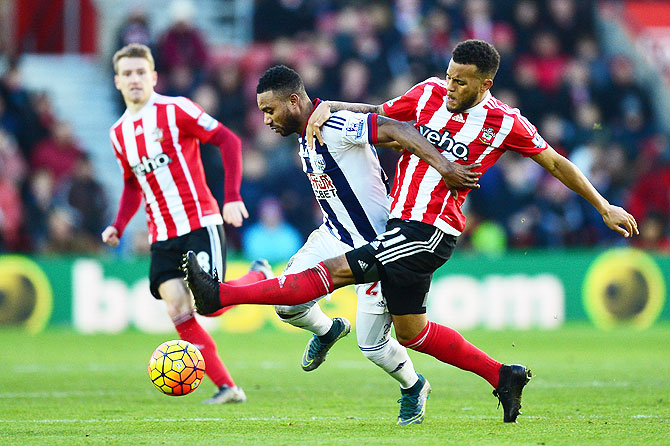 West Bromwich Albion's Stephane Sessegnon and Southampton's Ryan Bertrand compete for the ball during their match at St. Mary's Stadium in Southampton
