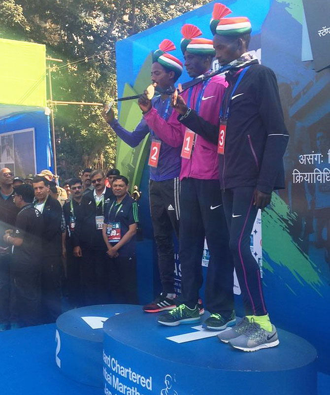 The International Elite Men winners pose with their medals on the podium at the prize distribution on Sunday