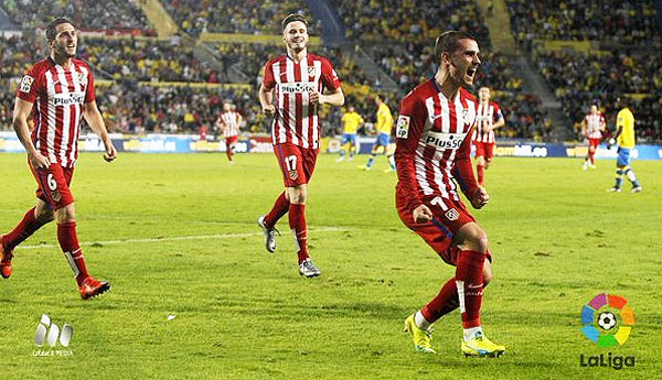 Atletico Madrid's Antoine Griezmann celebrates with teammates after scoring against Las Palmas during their La Liga match on Sunday