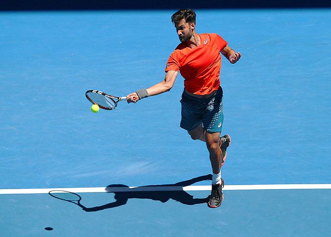 India's Yuki Bhambri plays a forehand his first round match against Czech Republic's Tomas Berdych during thier first round match at the 2016 Australian Open at Melbourne Park on Monday