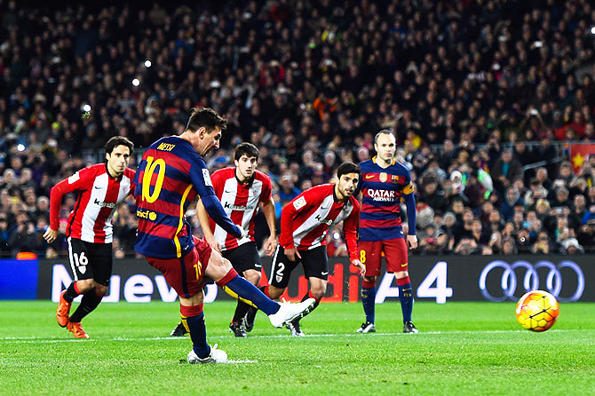 FC Barcelona's Lionel Messi scores the opening goal from the penalty spot against Athletic Club de Bilbao at Camp Nou