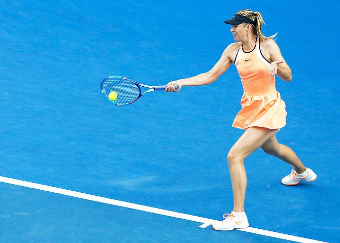 Russia's Maria Sharapova plays a forehand in her first round match against Japan's Nao Hibino