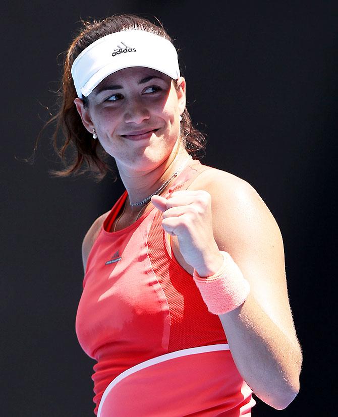 Spain's Gabine Muguruza celebrates winning her first round match against Estonia's Anett Kontaveit