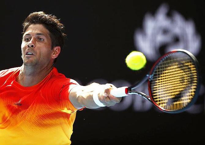 Spain's Fernando Verdasco stretches to hit a return against compatriot Rafael Nadal