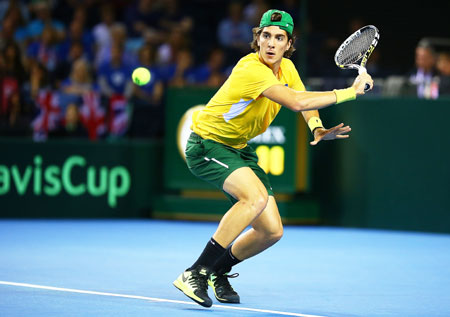 Thanasi Kokkinakis of Australia hits a return