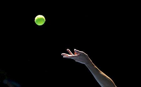 A player prepares to serve at the Australian Open tennis tournament at Melbourne Park