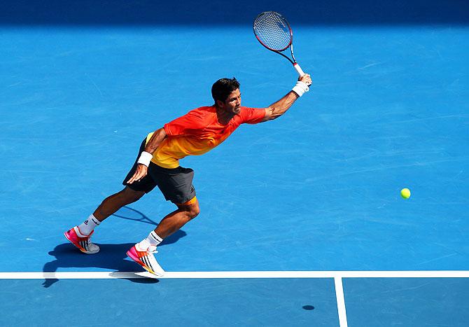 Fernando Verdasco plays a forehand in his first round match against Rafael Nadal