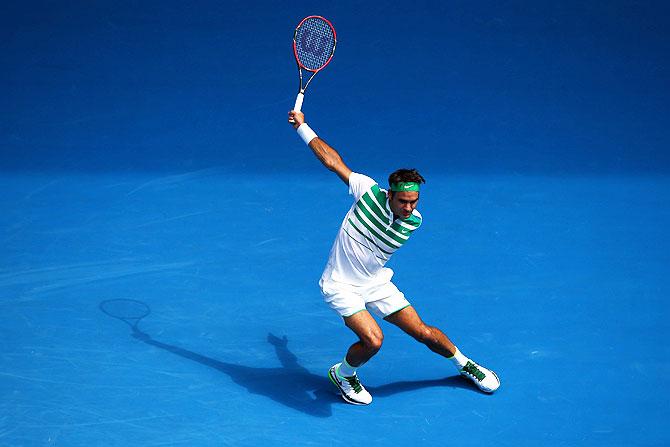 Switzerland's Roger Federer follows through in his second round match against Ukraine's Alexandr Dolgopolov