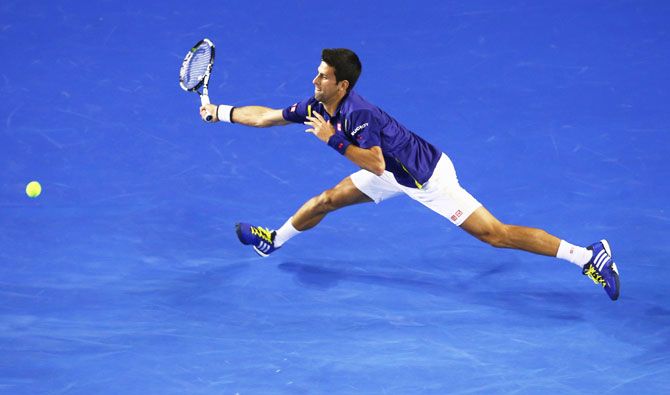 Serbia's Novak Djokovic stretches to play a forehand in his second round match against France's Quentin Halys at the 2016 Australian Open at Melbourne Park on Wednesday