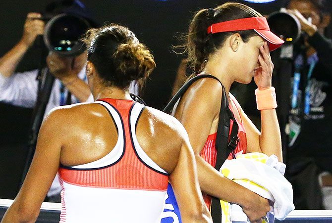 Serbia's Ana Ivanovic (right) leaves the court after losing in her third round match against USA's Madison Keys (left)