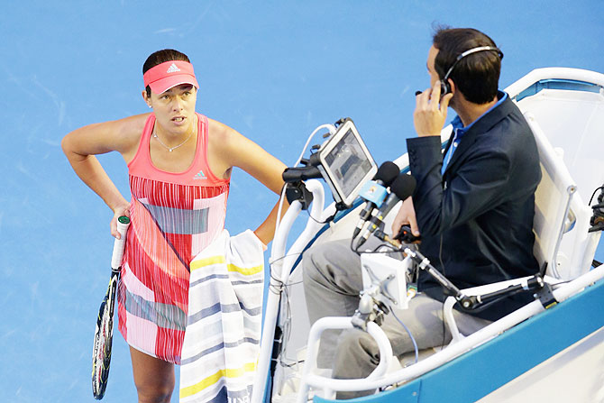 Ana Ivanovic speaks with the umpire after her coach collapsed in the stands
