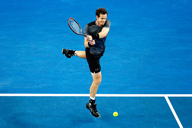 Andy Murray plays a backhand during his third round match against Joao Sousa