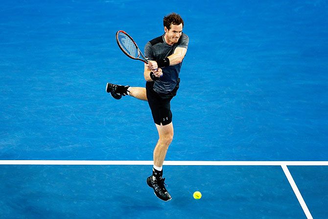 Andy Murray plays a backhand during his third round match against Joao Sousa