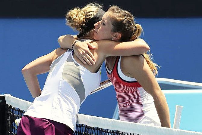 Germany's Annika Beck (right) hugs compatriot Laura Siegemund after winning her third round match