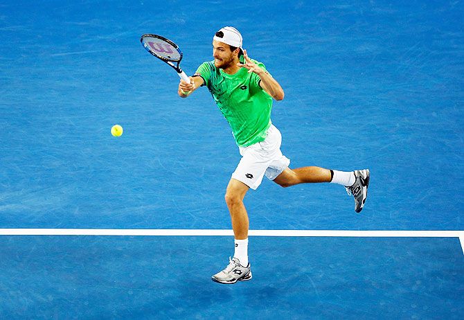 Joao Sousa plays a forehand during his third round match against Andy Murray