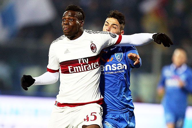 AC Milan's Mario Balotelli in action against an Empoli FC player during their Serie A match at Stadio Carlo Castellani in Empoli on Saturday