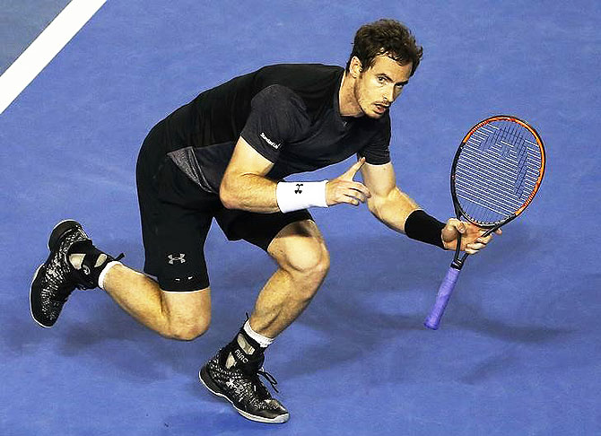 Andy Murray reacts after winning his fourth round match against Bernard Tomic