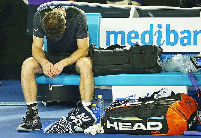 Andy Murray of Great Britain reacts after winning his fourth round match against Bernard Tomic of Australia on Monday