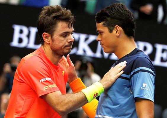 Canada's Milos Raonic (right) and Switzerland's Stan Wawrinka speak at the net 