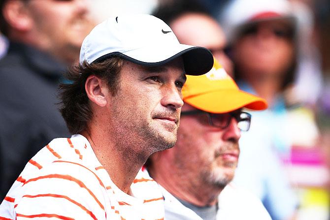 Milos Raonic's coach Carlos Moya looks on