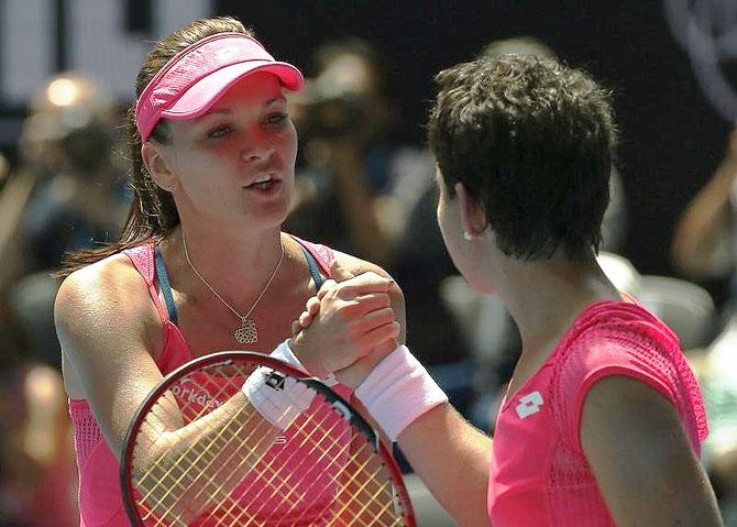 Poland's Agnieszka Radwanska (left) is congratulated by Spain's Carla Suarez Navarro after winning the quarter-final