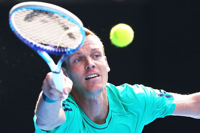 Czech Republic's Tomas Berdych plays a forehand in his quarter-final match against Switzerland's Roger Federer