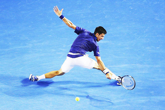 Serbia's Novak Djokovic plays a backhand in his quarter-final match against Japan's Kei Nishikori during the 2016 Australian Open at Melbourne Park on Tuesday