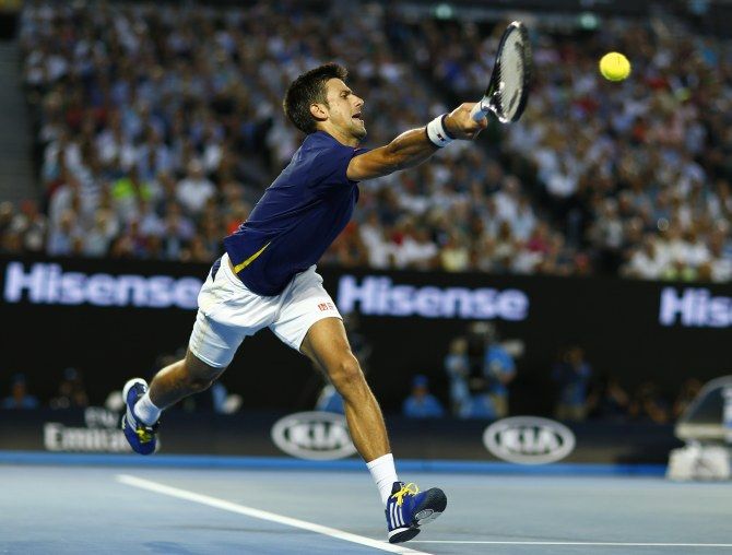 Novak Djokovic in action during his semi-final match against Roger Federer at the Australian Open. Photograph: Thomas Peter/Reuters