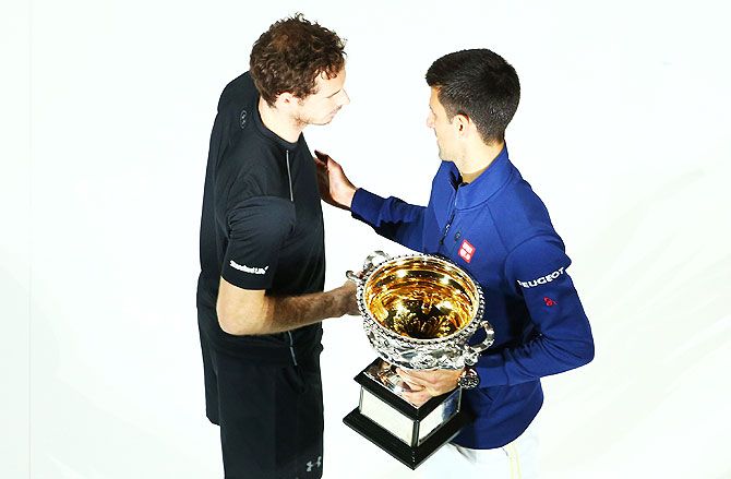 Australian Open champion Novak Djokovic greets Andy Murray during the trophy presentation after the final