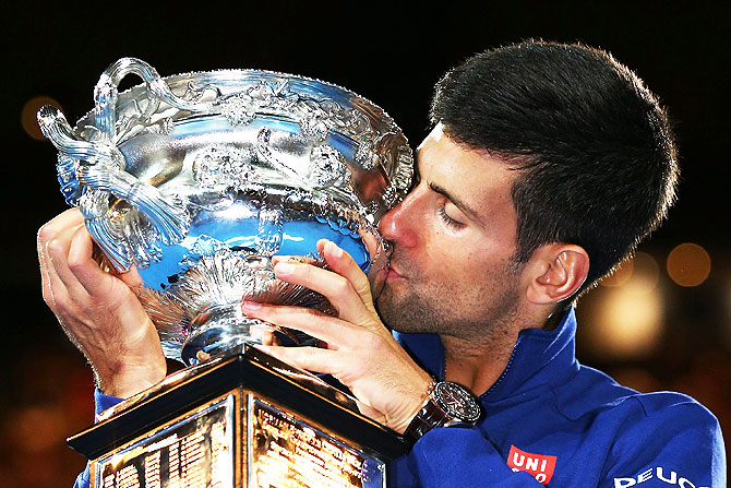Serbia's Novak Djokovic kisses the Norman Brookes Challenge Cup after winning the Australian Open men's singles final at Melbourne Park in January 2016