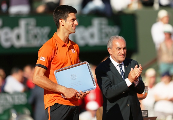 Novak Djokovic of Serbia holds the runners up trophy 