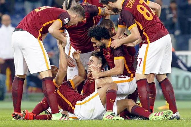 AS Roma's Stephan El Shaarawy (centre) celebrates with his teammates after scoring against Frosinone during their Serie A match at Olympic stadium in Rome on Saturday