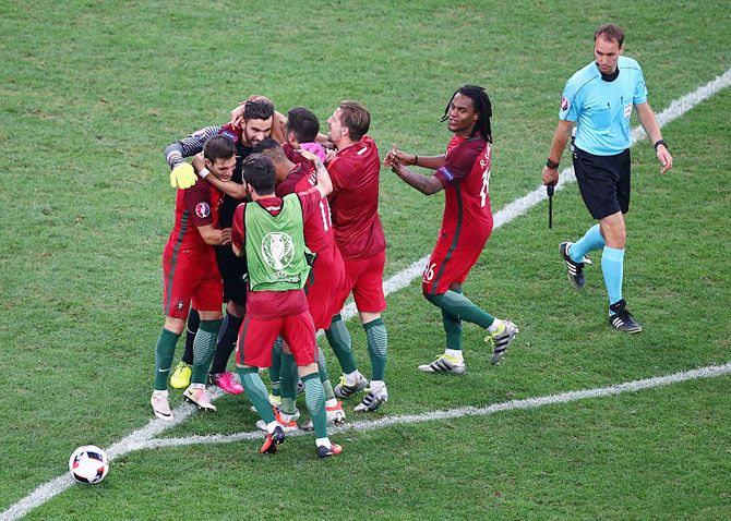 Portugal players celebrate after their win through the penalty shootout in the Euro 2016 quarter-final match against Poland at Stade Velodrome in Marseille on Thursday