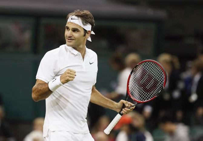 Switzerland's Roger Federer celebrates his victory against Great Britain's Daniel Evans on Friday