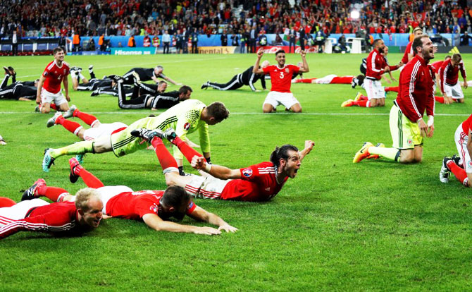 Wales players celebrate their Euro 2016 quarter-final win over Belgium in Lille 